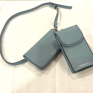 Calvin Klein wallet and cell phone carrier.